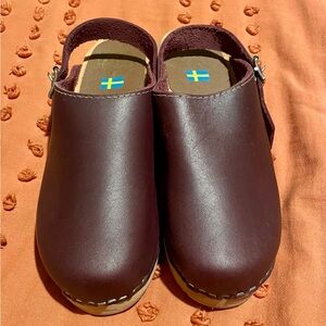 MIA Alma Swedish clogs with a buckle strap.